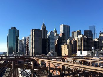 View of cityscape against blue sky