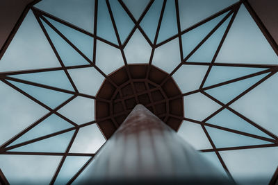 Low angle view of metal structure against sky