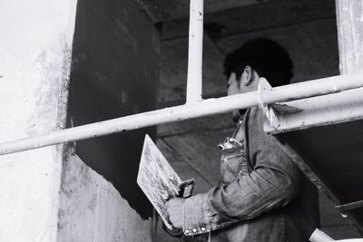 Low angle view of construction worker working in building