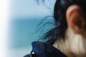 Close-up of woman against sea