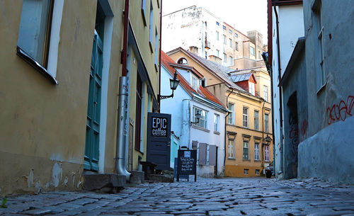 Alley amidst buildings in city