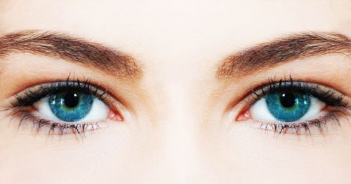 Extreme close up of woman with blue eyes