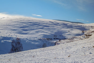 Sun over the winter mountains with snow, cindrel mountains, paltinis, romania