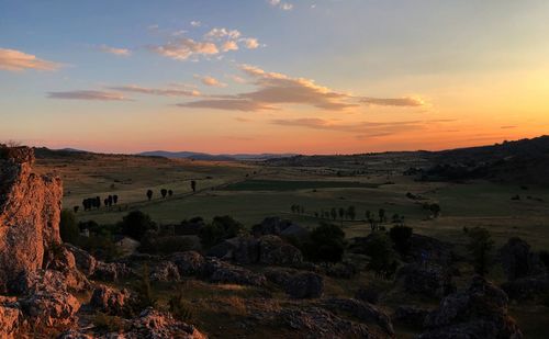 Scenic view of landscape against sky during sunset