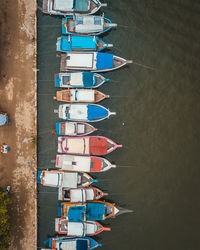 High angle view of people on boats moored in water