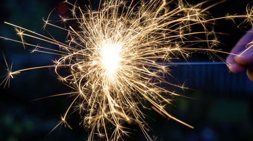 Low angle view of firework display at night