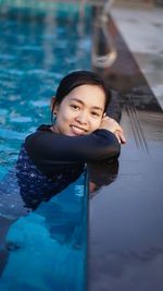 Young woman swimming in pool