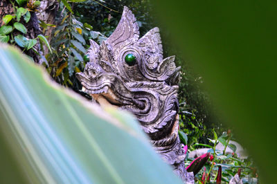 The statue in the garden sculpture, and symbols of buddhism, thailand.