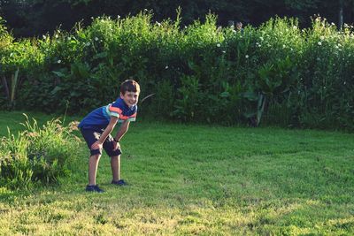 Full length of boy on field