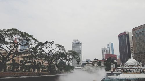 Buildings against clear sky in city