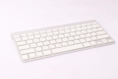 Close-up of computer keyboard against white background