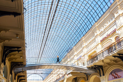 Low angle view of building seen through shopping mall