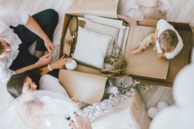 High angle view of people relaxing on table