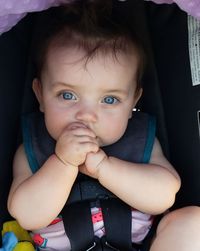 Portrait of cute baby girl sitting