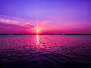 Scenic view of sea against romantic sky at sunset