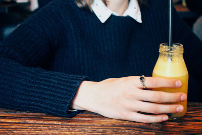 Cropped image of woman holding hands