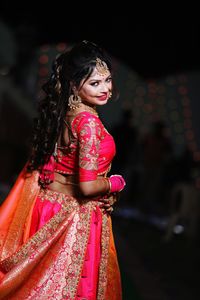 Portrait of smiling bride wearing sari during wedding ceremony