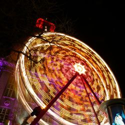 Low angle view of illuminated ferris wheel