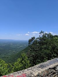 Scenic view of landscape against blue sky