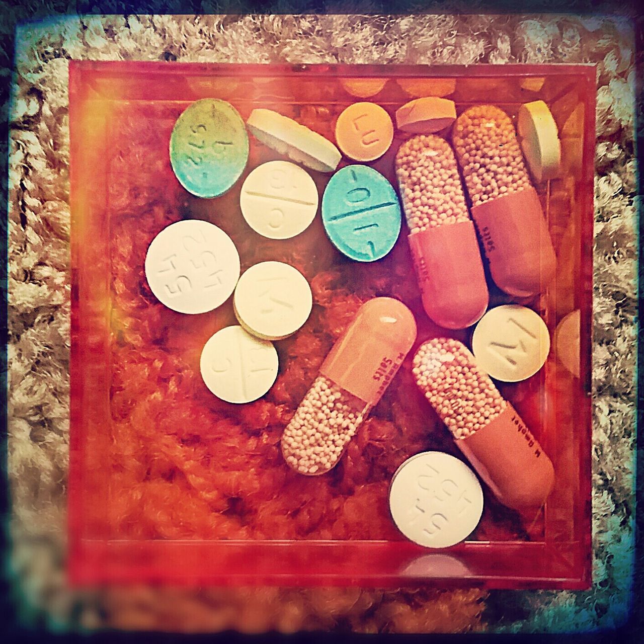 HIGH ANGLE VIEW OF MULTI COLORED CANDIES ON WOODEN TABLE