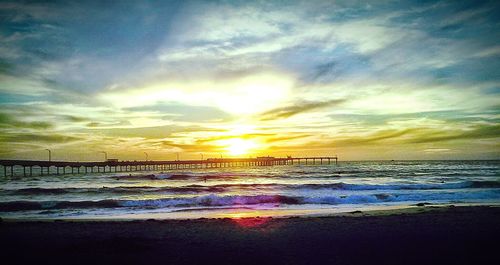 Scenic view of sea against cloudy sky