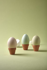 Close-up of cups against white background