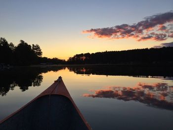 Scenic view of calm lake at sunset