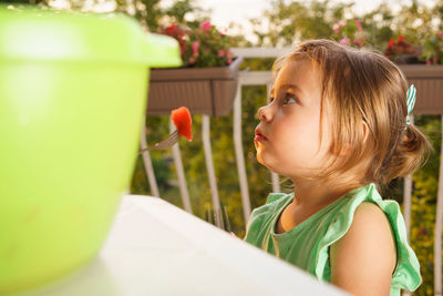 Close-up of cute girl looking away