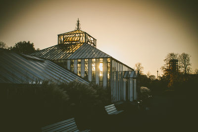 Built structure against clear sky at sunset