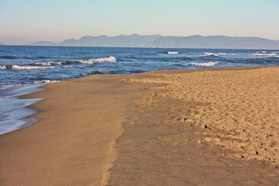 Scenic view of beach against clear sky