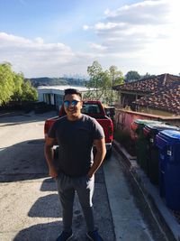 Portrait of young man standing outdoors