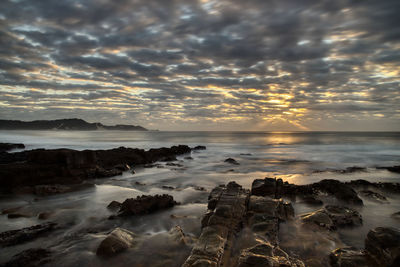 Scenic view of sea against sky during sunset