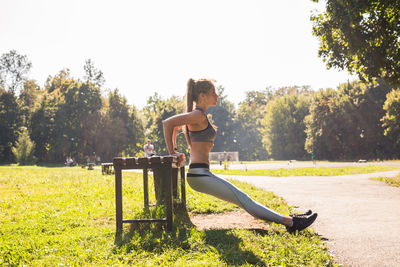 Full length of young woman in park