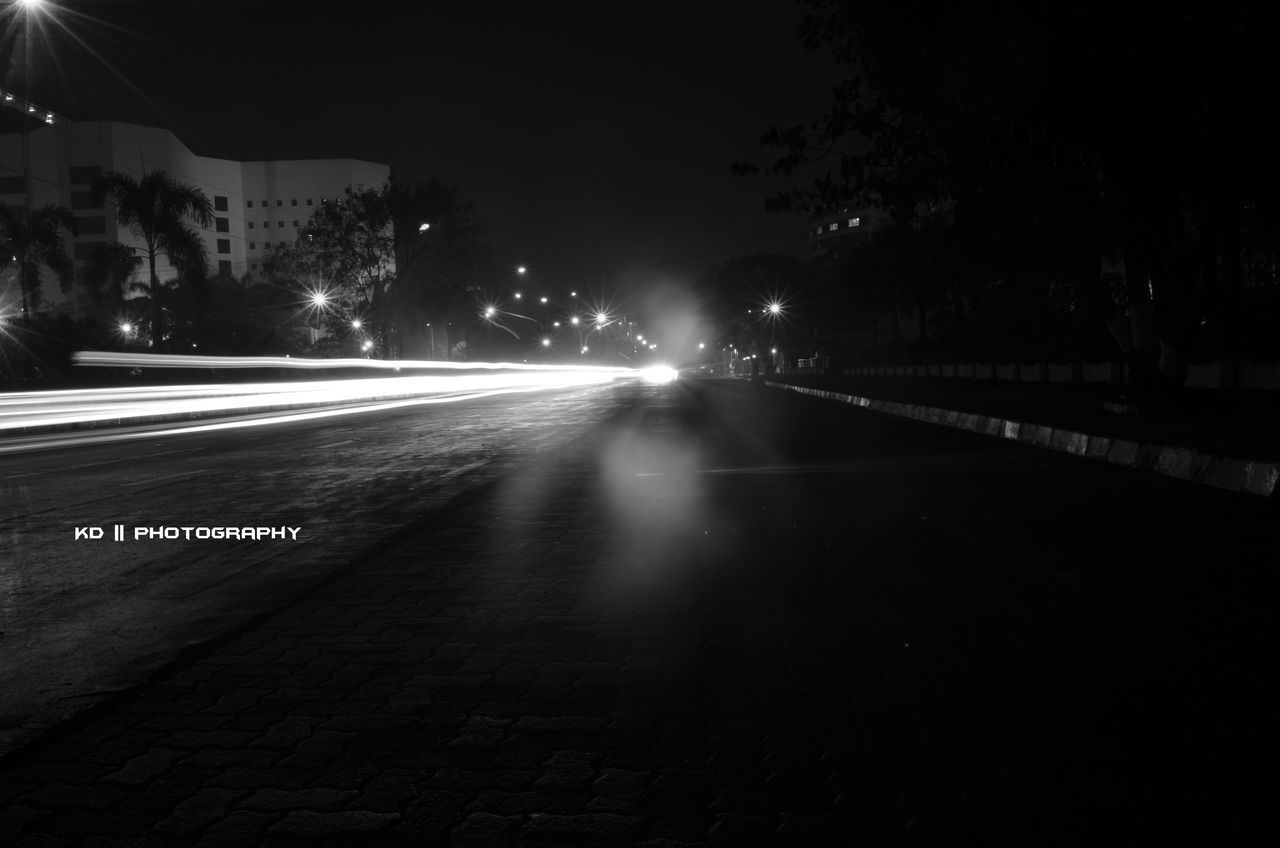 ILLUMINATED STREET LIGHTS AT NIGHT