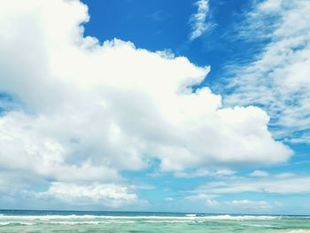 Scenic view of sea against cloudy sky