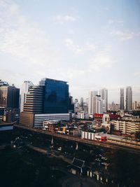 High angle view of buildings in city against sky