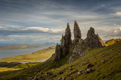 Rock formations on landscape against sky