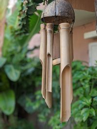 Close-up of birdhouse hanging on tree