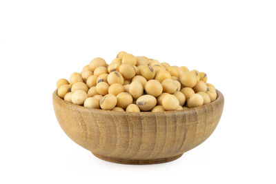 Close-up of eggs in bowl against white background