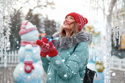 Woman wearing hat on snow during christmas