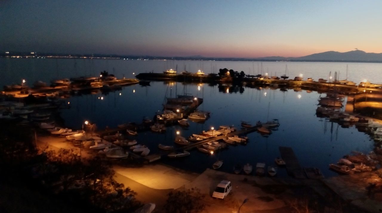 water, reflection, lake, tranquil scene, clear sky, tranquility, scenics, mountain, nature, sunset, beauty in nature, sea, dusk, copy space, nautical vessel, sky, idyllic, calm, outdoors, illuminated