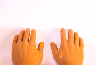 Close-up of hand against white background