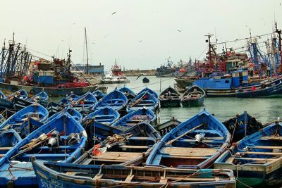 Boats moored at harbor