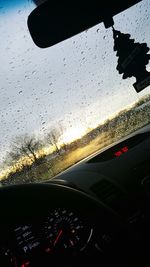 Reflection of sky seen through wet glass window