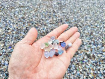 Close-up of hand holding stones