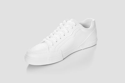 Close-up of shoes over white background