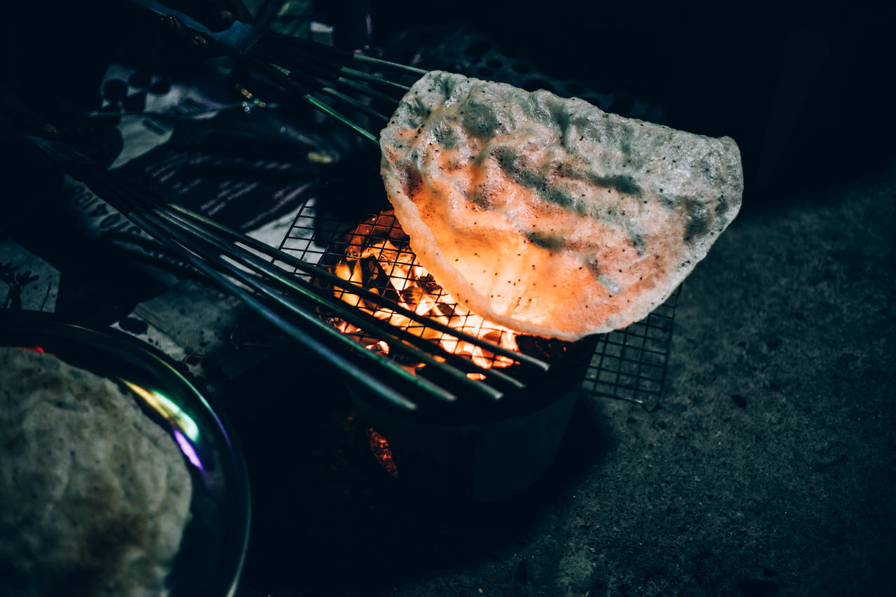 HIGH ANGLE VIEW OF BARBECUE GRILL IN CONTAINER