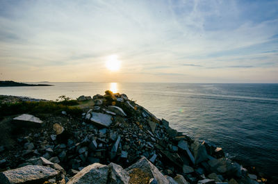 Scenic view of sea against sky at sunset