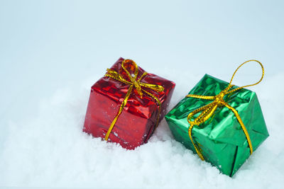 High angle view of christmas presents against white background