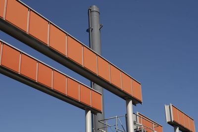 Low angle view of building against clear blue sky